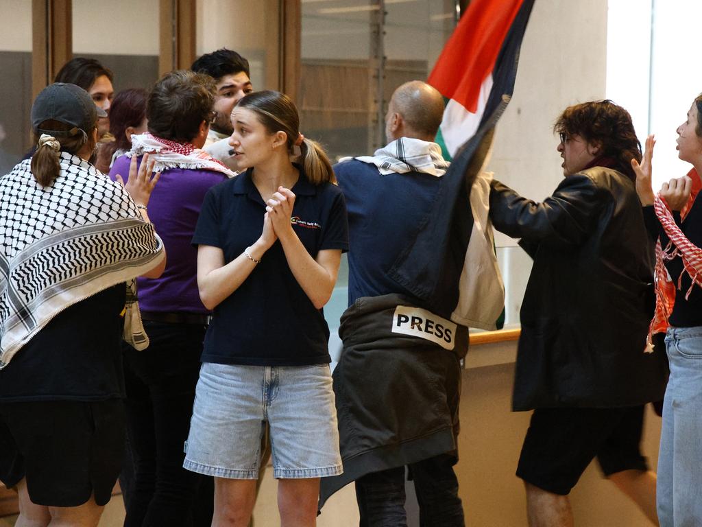Drew Pavlou has an altercation with pro-Palestinian protesters. Picture: David Clark