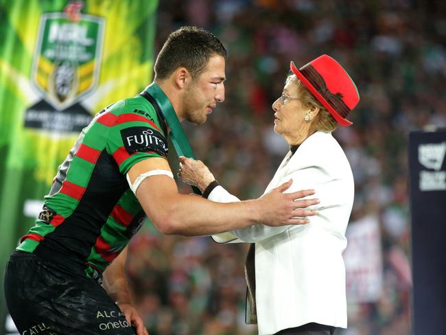 Sam Burgess receives the Clive Churchill Medal from Joyce Churchill. Picture: Gregg Porteous