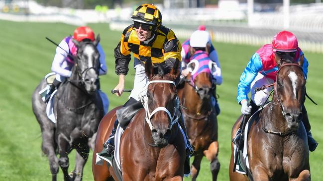 Damian Lane celebrates after Joliestar won the Group 1 Newmarket Handicap at Flemington. Picture: Pat Scala/Racing Photos via Getty Images