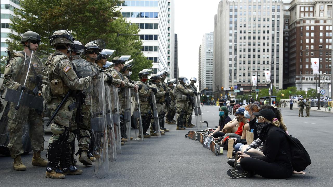 Pennsylvania National Guard holding shields face peaceful protesters. Picture: Matt Slocum/AP