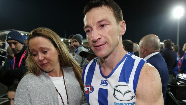 An emotional Brent Harvey and his wife Shayne after game. Picture: Michael Klein