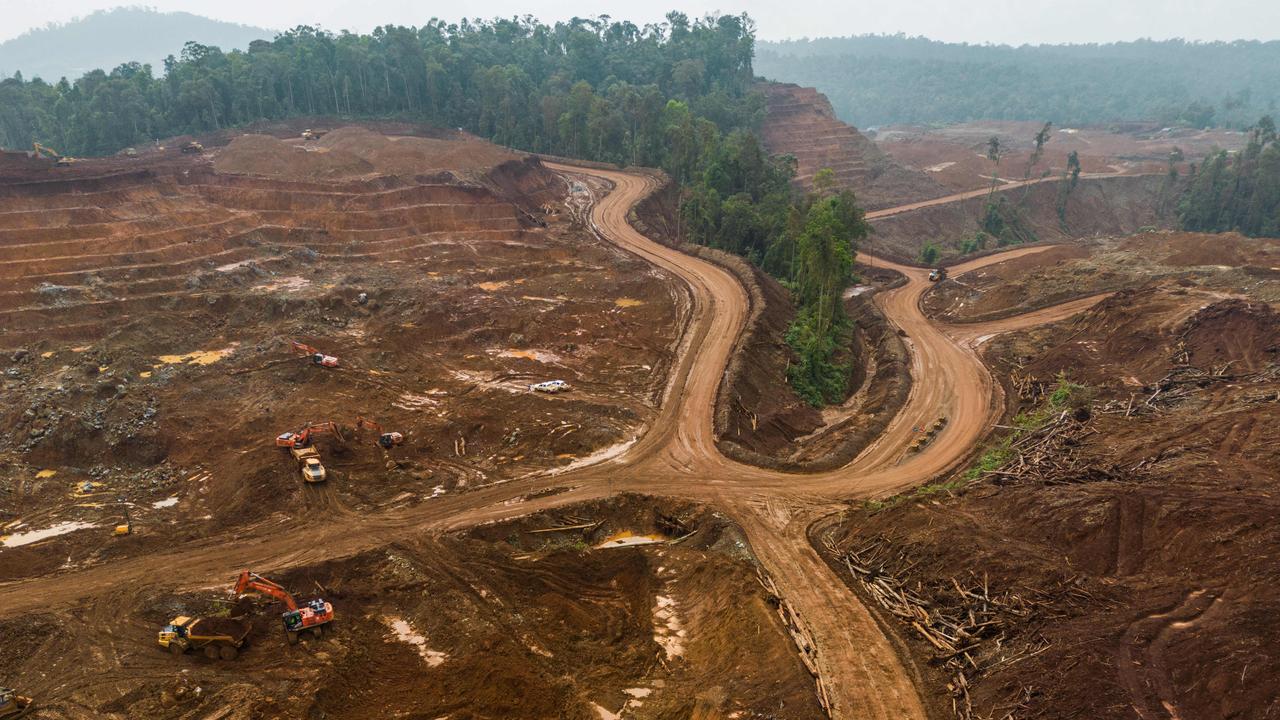 Excavators gather soil containing nickel ore at a mining site in Morowali, Central Sulawesi, Indonesia. Picture: Garry Lotulung