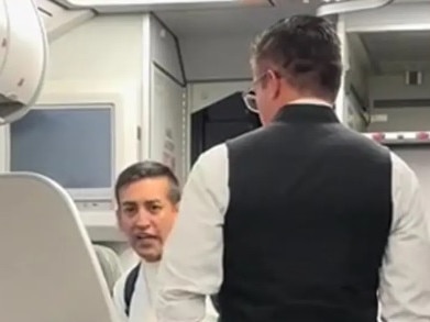 An irate passenger caused a scene after refusing to leave a plane that he was double-booked on, as seen in a video going viral online.