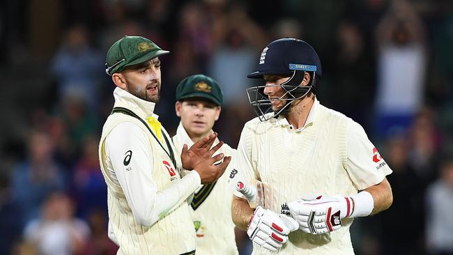 Nathan Lyon, left, with Joe Root during this year’s day-night Test at Adelaide Oval. Picture: AAP.