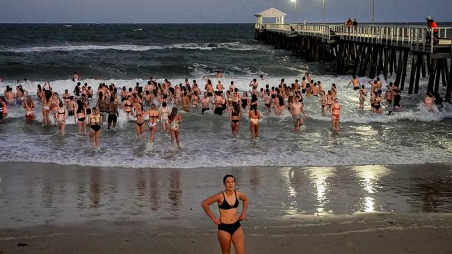 Salty Sips swimmers at Henley Beach where the group hit the water at 6.30am. Picture: Mike Burton.