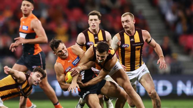 GWS Giant Isaac Cumming cops heat from Hawthorn’s Finn Maginness in round 17 at Giants Stadium. (Photo by Matt King/AFL Photos/via Getty Images)