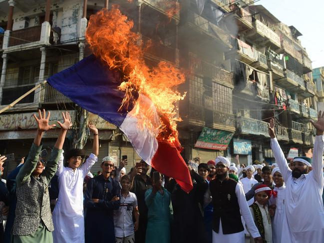 Pakistani Sunni Muslims burn a French flag during a protest in Karachi. Picture: AFP