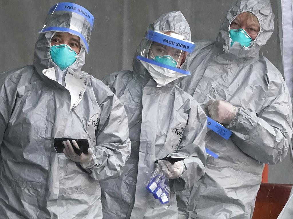 Health workers at New York’s first drive-through testing centre in New Rochelle last March. Picture: AFP