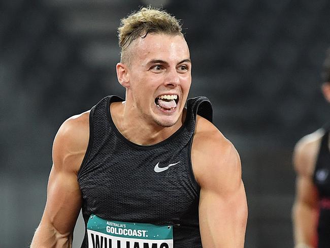 Trae Williams of Queensland crosses the line to win the Mens 100m Final at the Australian Athletics Championships competition on the Gold Coast, Friday, February 16, 2018. (AAP Image/Dave Hunt) NO ARCHIVING