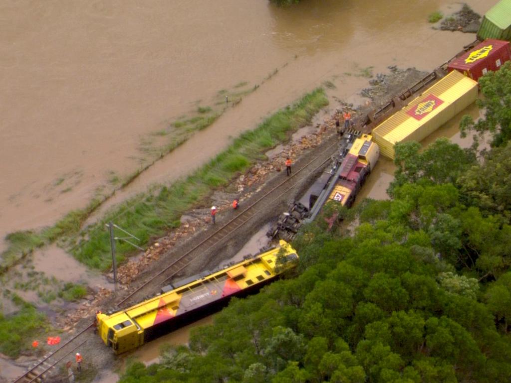 A freight train derailed in floodwaters at Traveston, south of Gympie, on Tuesday night. Picture 7 News