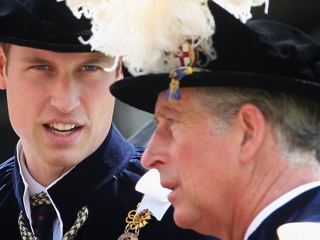 Britain's Prince William, left, looks to his father, Prince Charles, right, as they take part in the Garter Ceremony Procession up to St George's Chapel, Monday, June 15, 2009 in Windsor, England. The Annual Order of the Garter Service which takes place at Windsor Castle, is a ceremonial event involving Knights of the Garter who are appointed personally by Britain's Queen Elizabeth II. (AP Photo/Chris Jackson/pool)