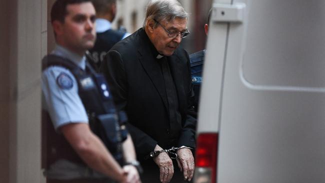 Cardinal George Pell leaves the Supreme Court in handcuffs. Picture: AAP