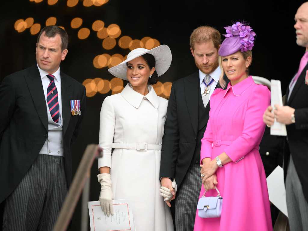 TOPSHOT - (L-R) Peter Phillips, Meghan, Duchess of Sussex, Britain's Prince Harry, Duke of Sussex, Zara Phillips and Mike Tindall leave after attending the National Service of Thanksgiving for The Queen's reign at Saint Paul's Cathedral in London on June 3, 2022 as part of Queen Elizabeth II's platinum jubilee celebrations. - Queen Elizabeth II kicked off the first of four days of celebrations marking her record-breaking 70 years on the throne, to cheering crowds of tens of thousands of people. But the 96-year-old sovereign's appearance at the Platinum Jubilee -- a milestone never previously reached by a British monarch -- took its toll, forcing her to pull out of a planned church service. (Photo by Daniel LEAL / POOL / AFP)