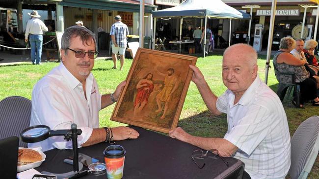 Craig Winter from Winter Auctions chats with Merv Cranfield about a work of art he took to the fair for appraisal. Picture: Alistair Brightman