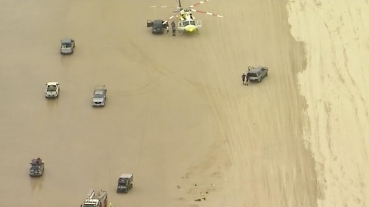 The scene of the 4WD rollover at Teewah Beach on Sunday afternoon. Photo: Nine News