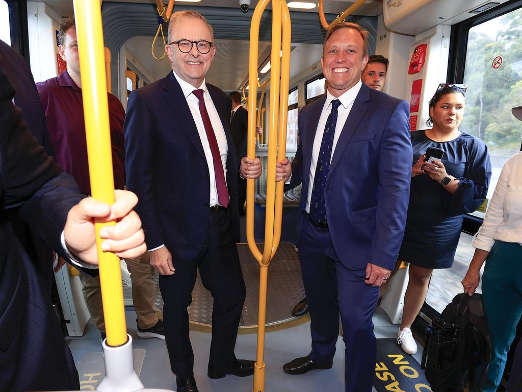 Premier Steven Miles and Prime Minister Anthony Albanese ride on the light rail on the Gold Coast. Picture: Adam Head