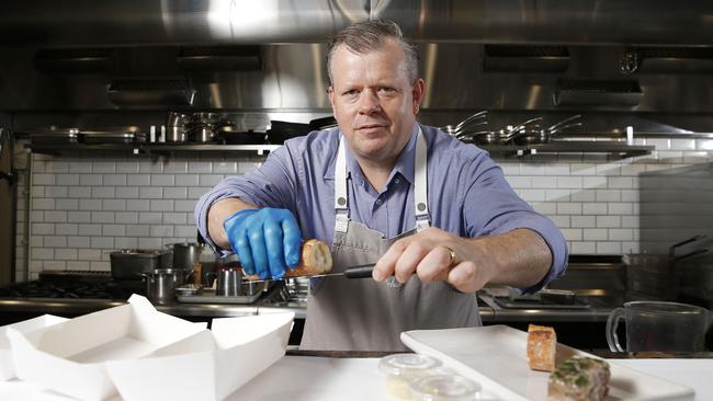 Owner Shannon Kellam of Montrachet preparing takeaway food in their Bowen Hills restaurant last month. Food is now prepared in their new production kitchen. Picture: Josh Woning