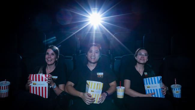 Jess McLean, Adam Tran and Caitlin Guy ahead of BCC Cinemas Casuarina reopening on Thursday. Picture: GLENN CAMPBELL