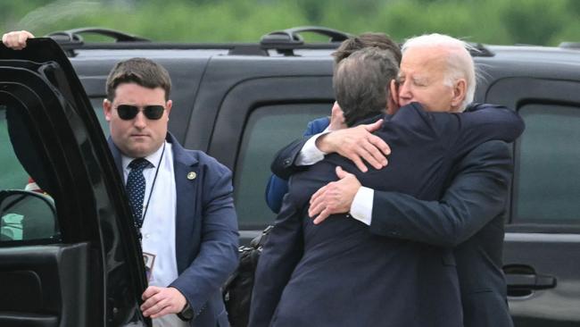 US President Joe Biden hugs his son Hunter Biden upon arrival at Delaware Air National Guard Base in New Castle, Delaware, on June 11, 2024. (Photo by ANDREW CABALLERO-REYNOLDS / AFP)