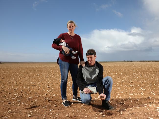 Eyre Peninsula farmers Gabrielle and Jarryn Priess with baby Bodhi on their Arno Bay property. Picture: ROBERT LANG