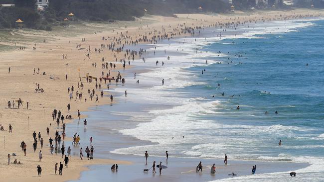 Hundreds of people ‘exercising’ on Gold Coast beaches on Monday even though they were advised to stay home. Picture: Adam Head