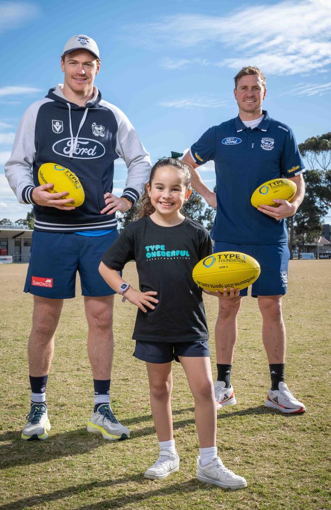 Willow Micallef with Geelong Cats players Gary Rohan and Mitch Duncan. Picture: Brad Fleet