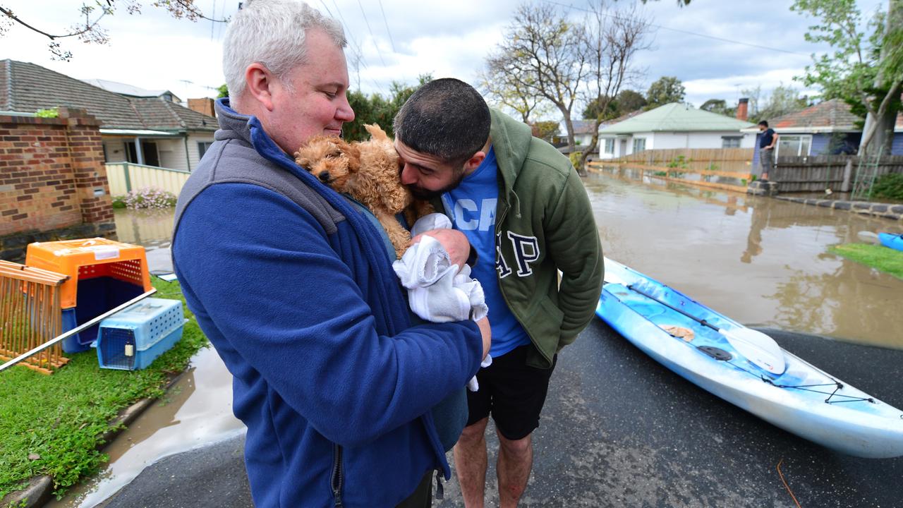 Craig Constable and partner Jehad, with 11-week-old puppy Teddy. Picture: Nicki Connolly