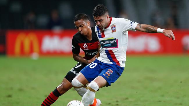 Dimitrios Petratos of the Jets competes with Keanu Baccus in round 19 of the W-League.