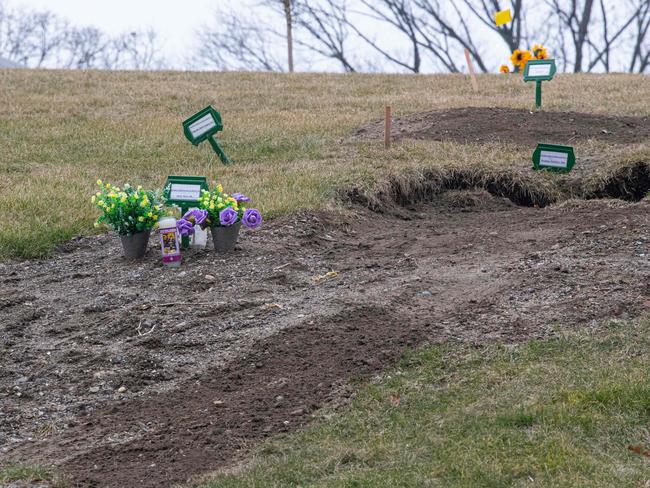 Flowers are placed on fresh graves at Woodlawn Cemetery in New York as the global coronavirus death toll surpassed two million. Picture: AFP