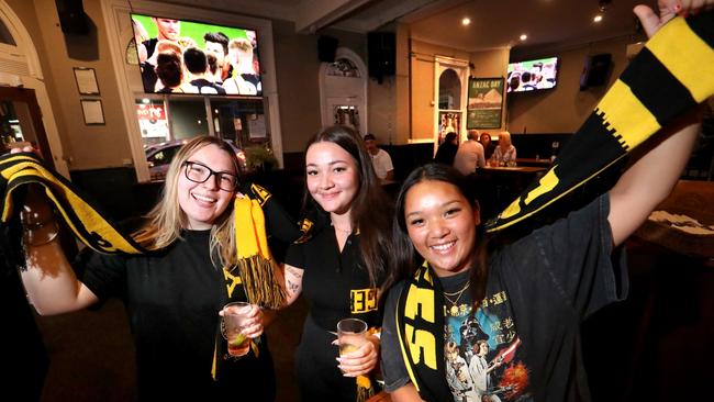 Richmond supporters Holly Welch, Emily Patrikakos, and Hayley Jong at the Swan hotel in Melbourne. Picture: David Geraghty.