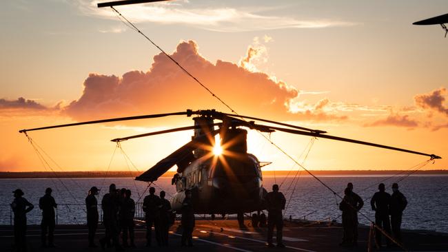 An Australian Army CH-47F Chinook helicopter at sunset onboard HMAS Adelaide during Operation Tonga Assist 2022. Picture: LSIS David Cox