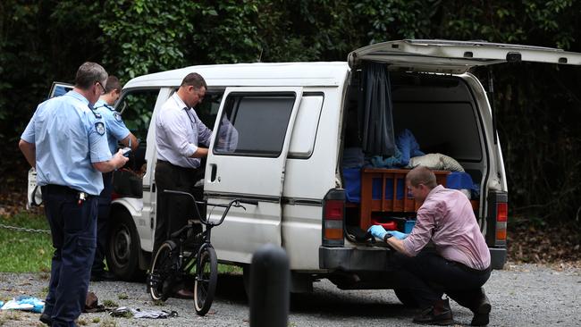 Police officers search the van belonging to Frederic Andre who died at Kearneys Falls in 2013.