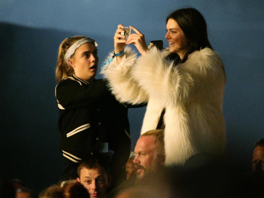 Kendall Jenner and Cara Delevingne watching Kanye West performing on the Pyramid Stage at the 2015 Glastonbury Festival. Picture: AAP