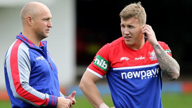 Knights coach Nathan Brown talks to Trent Hodkinson at training. Picture by Peter Lorimer.
