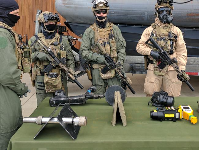 Commandos show off the weapons that can now be used when taking the lead in attacks on terrorists.