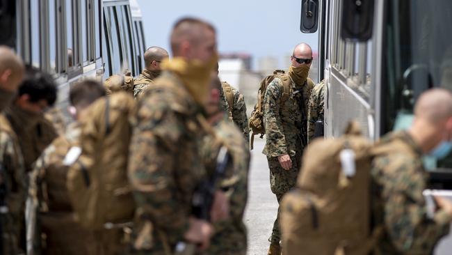 Last year’s rotation of US Marines disembark at RAAF Base Darwin. The 2020 contingent is expected soon and faces strict quarantine protocols. Picture: Harrison Rakhshani