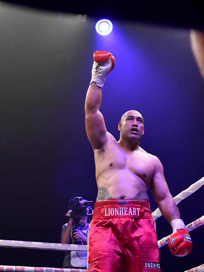 Alex Leapai of Australia celebrates winning against Thomas Peato. (AAP Image/Darren England)