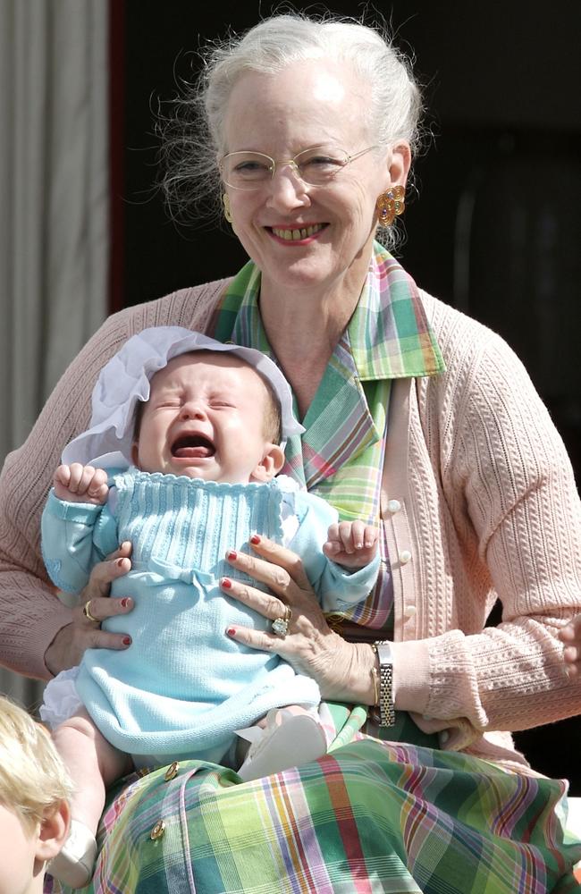 Queen Margrethe holds her new granddaughter at Grasten Palace. Picture: Julian Parker/UK Press via Getty Images