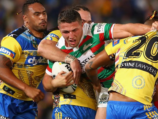 SYDNEY, AUSTRALIA - MAY 13: Sam Burgess of the Rabbitohs is tackled during the round 10 NRL match between the Parramatta Eels and the South Sydney Rabbitohs at Pirtek Stadium on May 13, 2016 in Sydney, Australia. (Photo by Cameron Spencer/Getty Images)