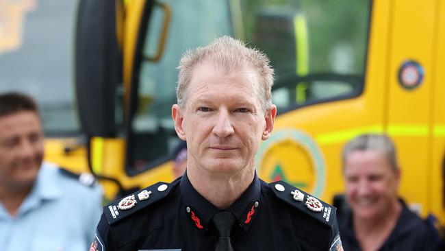 QFES Commissioner Greg Leach farewells another group of firefighters heading south. Picture: Liam Kidston