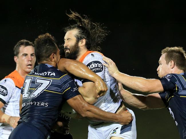 Aaron Woods hits the ball up for the Tigers. Picture: Mark Evans
