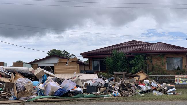 Homes in Mullumbimby have large piles of impacted furniture and belongings piled high on the nature strip. Picture: Liana Boss