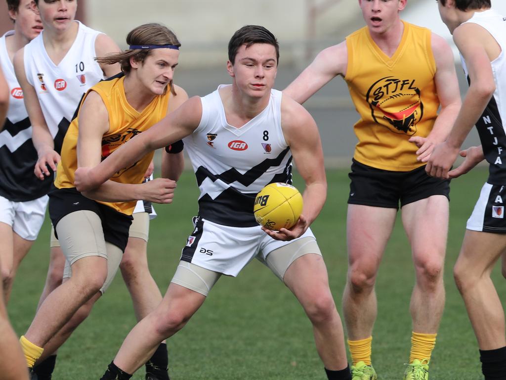 Under 16 Boys STJFL vs. NTJFA match, North Hobart Oval: North's Cooper Foot-Hill in heavy traffic. Picture: LUKE BOWDEN