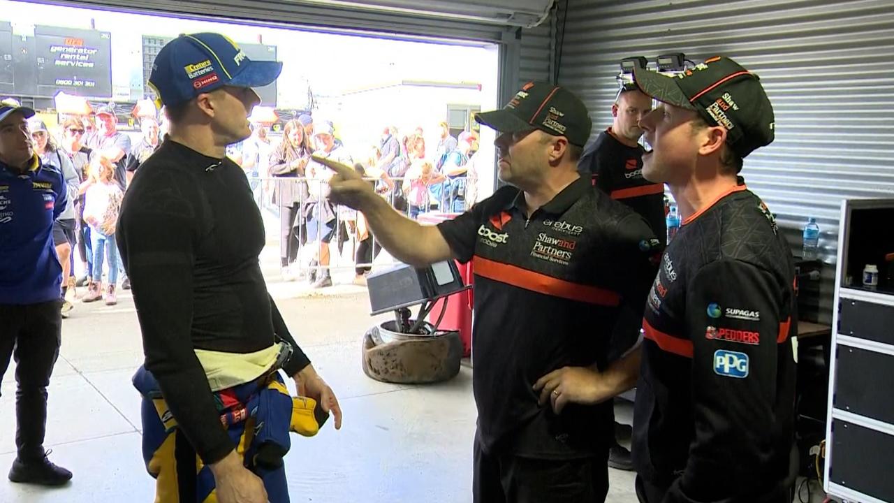 Mark Winterbottom (left) gets into a heated argument with Erebus Motorsport team boss Barry Ryan (middle) and driver Will Brown (right) after their crash at Pukekohe Park Raceway. Photo: Fox Sports