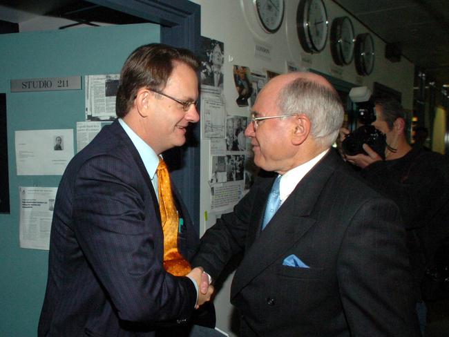 Then Prime Minister John Howard with the infamous handshake with Mark Latham.