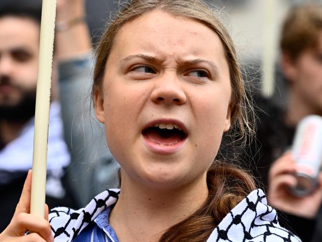 Swedish climate activist Greta Thunberg, wearing a checkered head scarf (kaffiyeh or keffiyeh), takes part in a demonstration organised by forty Swedish social justice movements under the message 