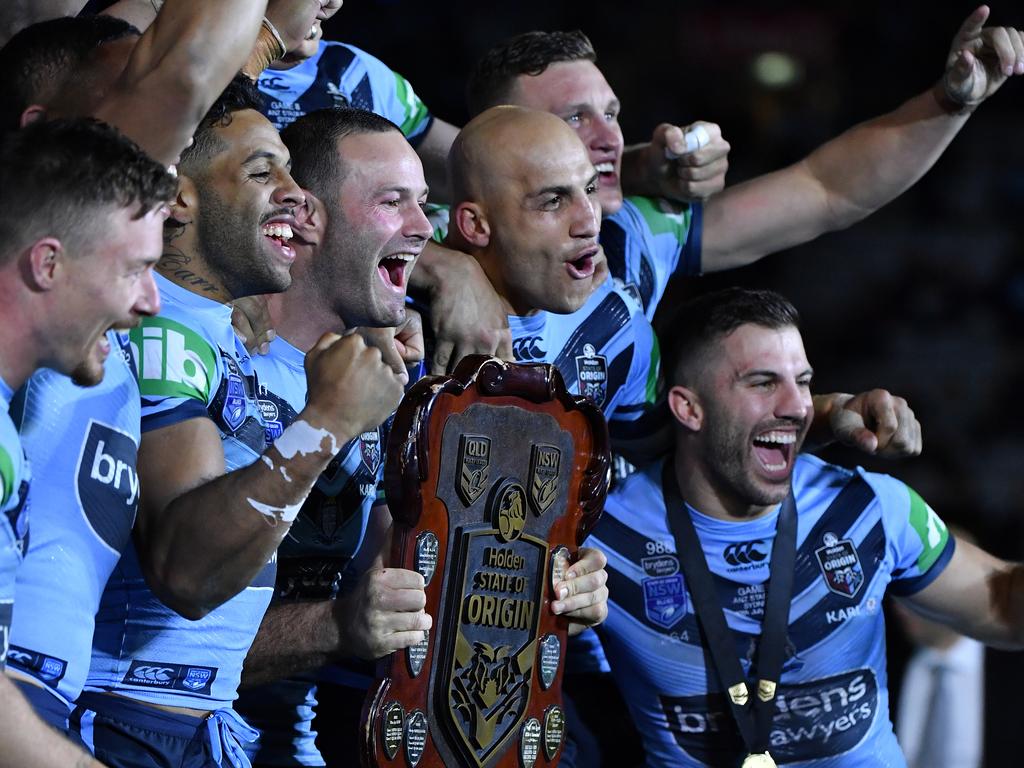 The NSW Blues captain Boyd Cordner celebrates with his teammates after receiving the State of Origin Shield in 2019.