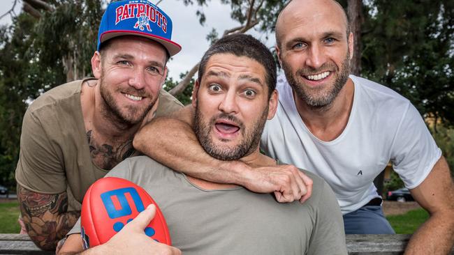 Brendan Fevola (centre) with former Footy Show panellists Dane Swan and Chris Judd. Picture: Jake Nowakowski