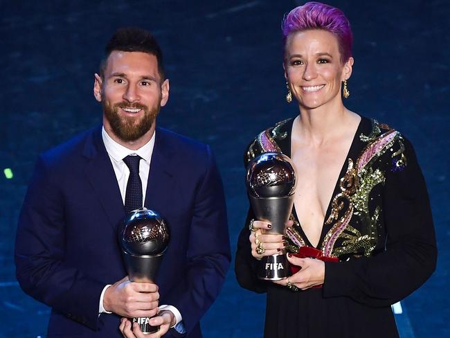 TOPSHOT - Best FIFA Men's Player of 2019, Argentina and Barcelona forward Lionel Messi (L) and Best FIFA Women's Player of 2019, US and Reign FC midfielder Megan Rapinoe pose at the end of The Best FIFA Football Awards ceremony, on September 23, 2019 in Milan. (Photo by Marco Bertorello / AFP)