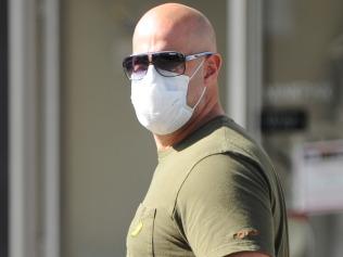 A man wears a mask to Cronulla Mall as coronavirus fears grow in Sydney, Saturday, March 28, 2020. (AAP Image/Simon Bullard) NO ARCHIVING